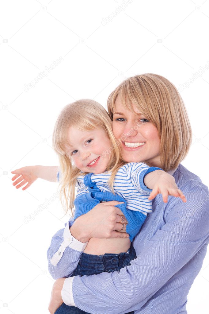Smiling embracing mom and daughter