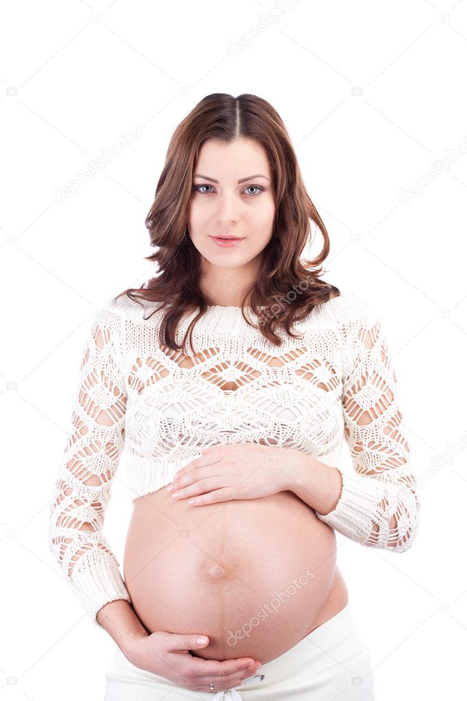 Pregnant smiling woman holding belly
