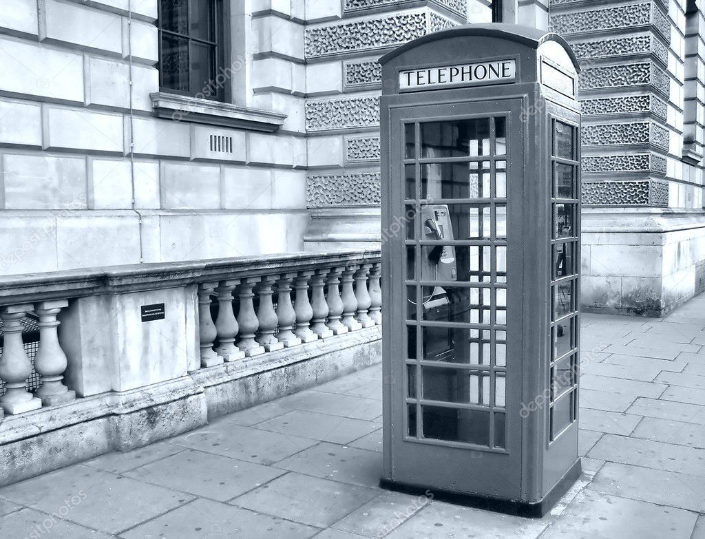 Traditional red telephone box in London, UK - high dynamic range HDR - black and white