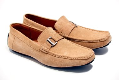 Pair of brown male loafers over white background clipart