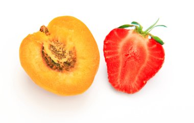 Apricot and strawberry cut open on white background clipart