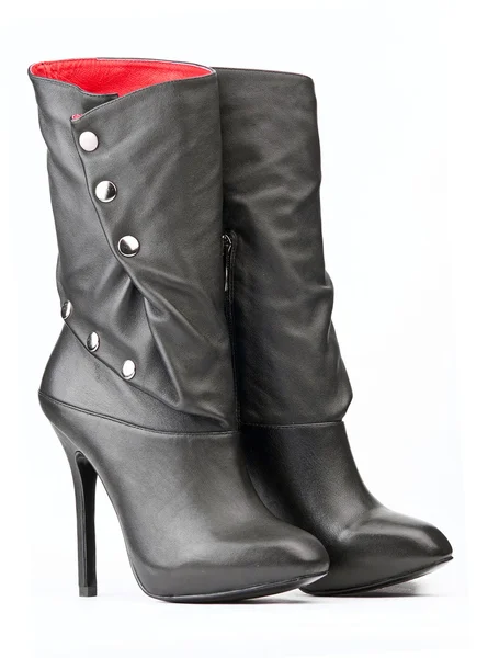 Pair of black female boots with red lining on the white background — Stock Photo, Image