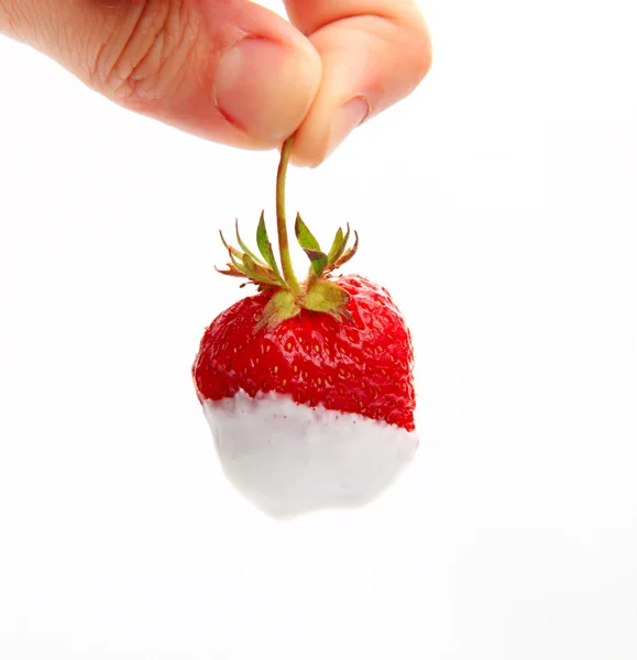 Close-up image of strawberry dipped into sour cream — Stock Photo, Image