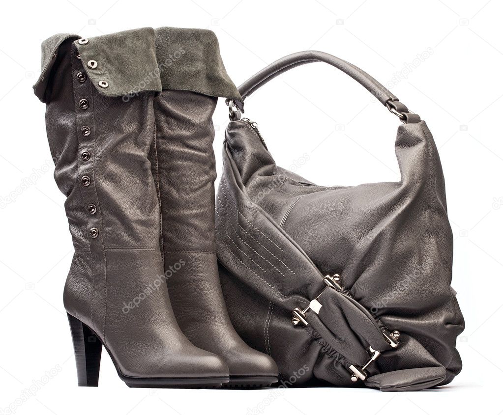 Gray female high-heeled boots and bag on the white background