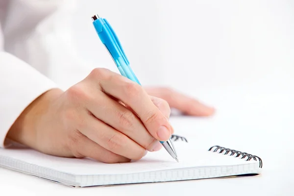 Hand writing with ballpoint pen, close-up shot Royalty Free Stock Images
