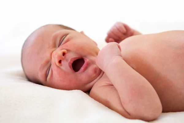 Cute one week old baby boy yawning — Stock Photo, Image