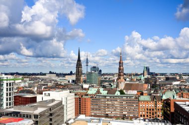 The old town of Hamburg with the St. Katherina and Nikolai churches and the city hall clipart