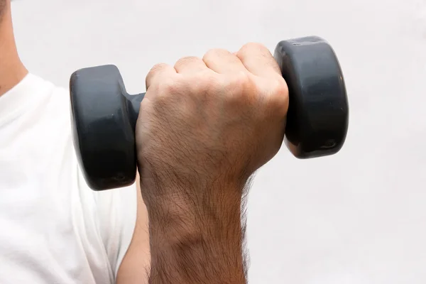 stock image Young men training body sculpture by lifting weights, isolated