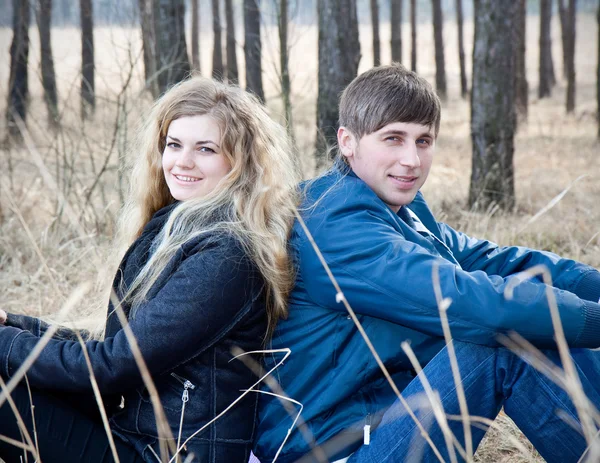 stock image Beautiful young couple smiling together in forest