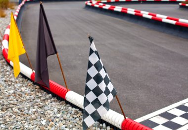 Flags on carting track clipart