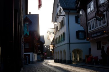 Street of old european town in evening light clipart