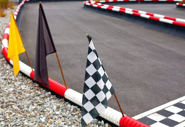 Flags on carting track — Stock Photo, Image