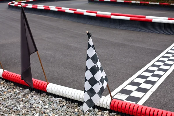 Flags on carting track — Stock Photo, Image