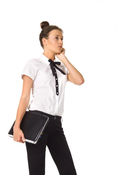 Woman standing and holding a laptop in hand — Stock Photo, Image