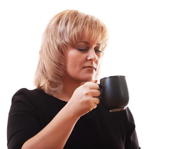 Stock image Woman's blonde holding a mug of hot tea on white background