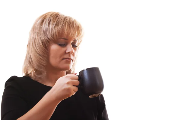 stock image Woman's blonde holding a mug of hot tea on white background