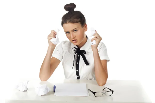 Brunette office desk for swearing and crumples papers — Stock Photo, Image