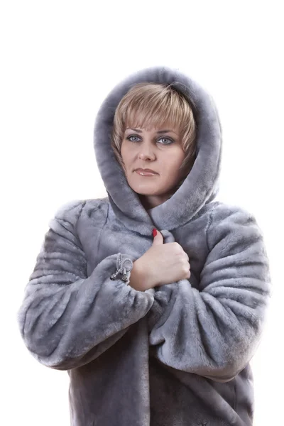 Portrait of woman wearing a fur coat faux fur — Stock Photo, Image