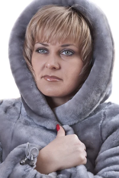 stock image Portrait of woman wearing a fur coat faux fur isolated