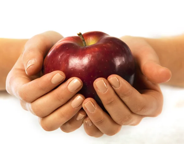 Fresh red apple in a woman hand — Stock Photo, Image