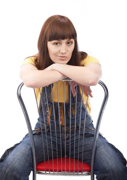 Θετική ενήλικης γυναίκας, που κάθεται σε μια καρέκλα — Φωτογραφία Αρχείου