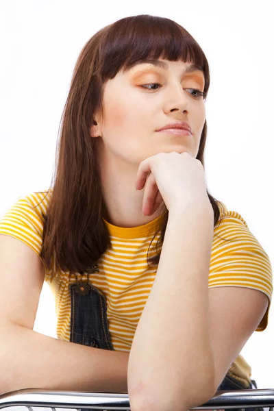 Positive adult woman sitting on a chair — Stock Photo, Image