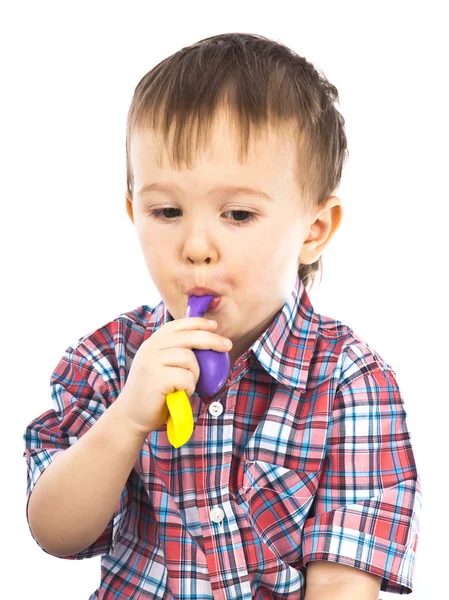 stock image Little boy playing with inflatable balls colored