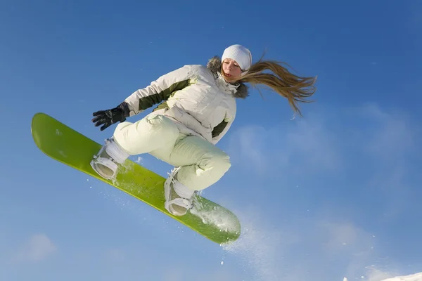 stock image Young woman Snowboarder on a jump