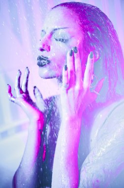 Young woman with bright make-up having shower clipart