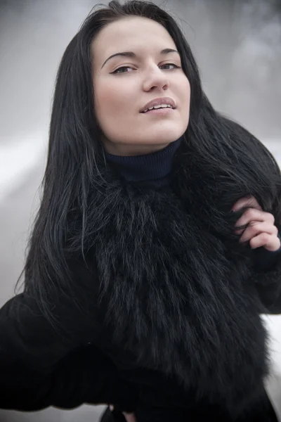 Charming young woman in fur clothes — Stok fotoğraf