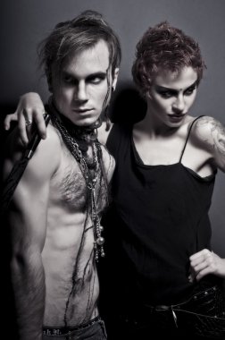 Portrait of a fashionable young attractive couple posing as a vampires or zombies clipart