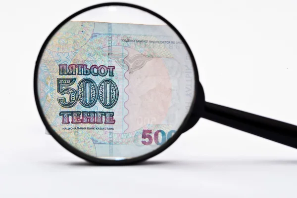 stock image Currency and magnifying glass