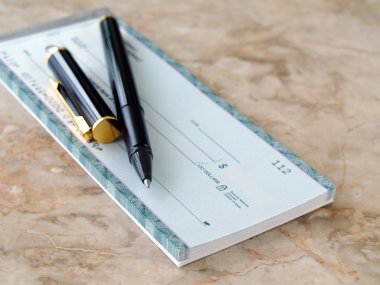 Cheque with pen. clipart