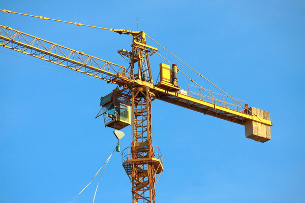 Crane building construction with blue sky background
