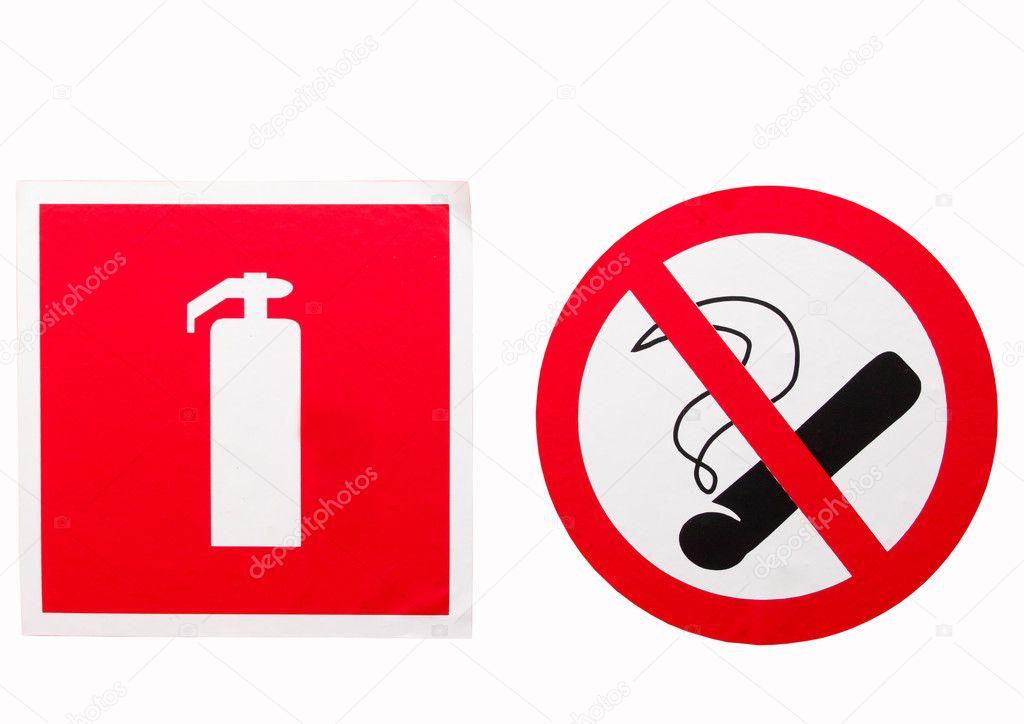 No smoking sign and a fire extinguisher on the wall