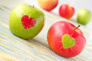 Green and red apple with a heart symbol clipart