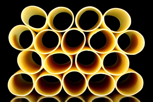 Stock image Cannelloni pasta tubes on a black background