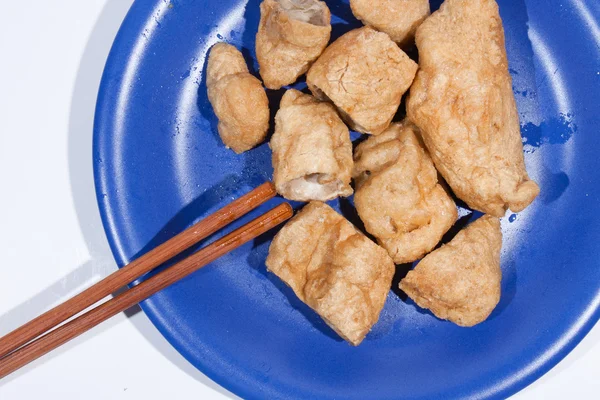 Fried fish balls with chopsticks. — Stock Photo, Image