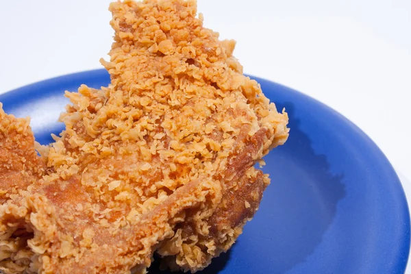 Fried chicken dish dark blue. — Stock Photo, Image