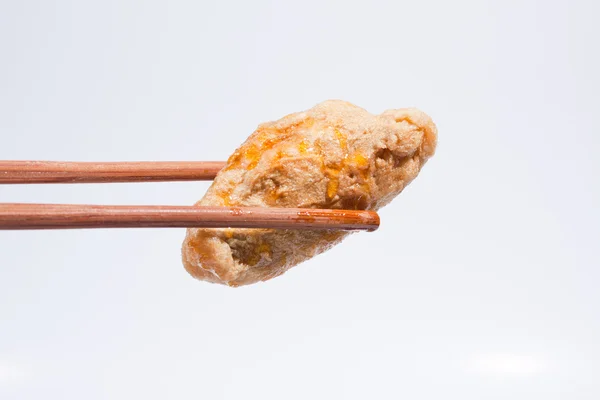 Fried fish balls with chopsticks. — Stock Photo, Image