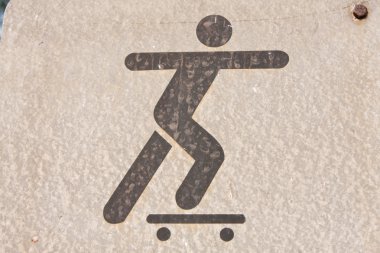 A symbol, are playing skateboarding. clipart