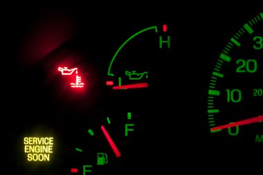 Dash with no oil pressure and service engine light on clipart