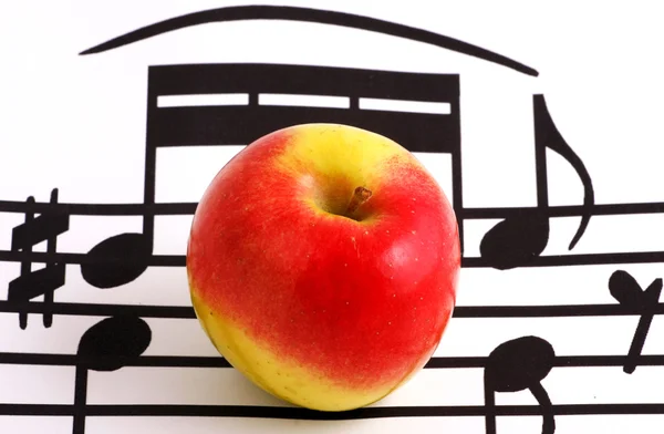 Elementi di notazione musicale e mela — Foto Stock