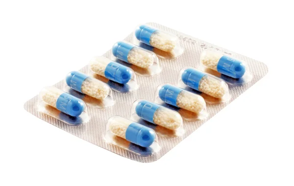 Blue capsules on a white background — Stock Photo, Image