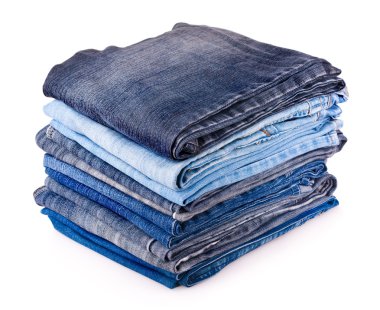 Stack of various jeans isolated on white background clipart