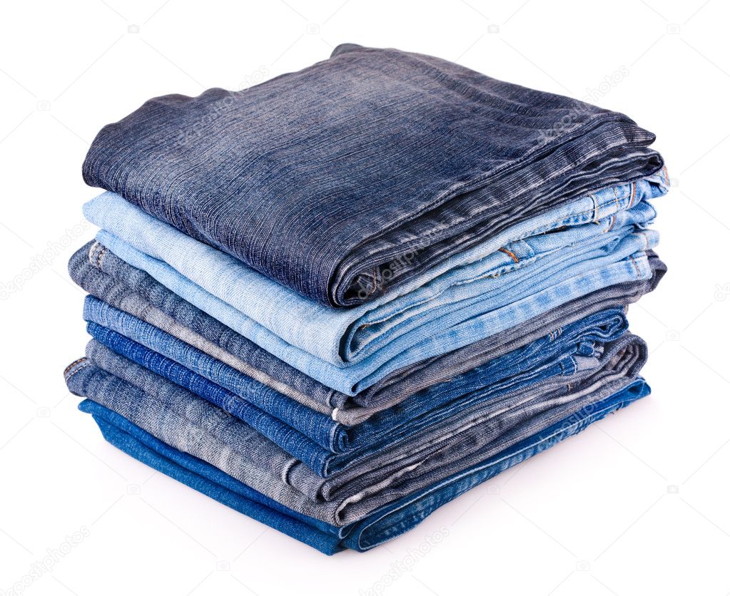 Stack of various jeans isolated on white background
