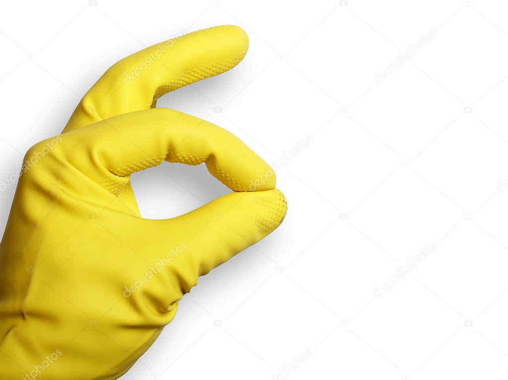 The image shows a human hand with a rubber glove over white