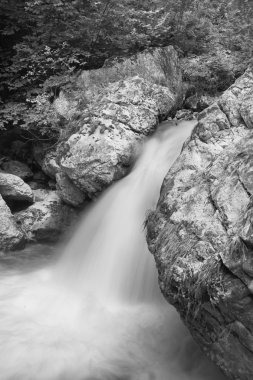 Small waterfall on Bicaz River in Bicaz Gorges, Romania. clipart