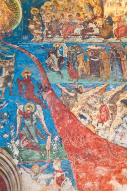 Vertical detail of the Last Judgement of exterior walls of Humor Painted Monastery in Romania. clipart