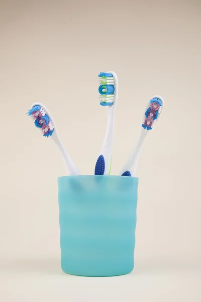 Colorful Toothbrushes Blue Glass — Stock Photo, Image
